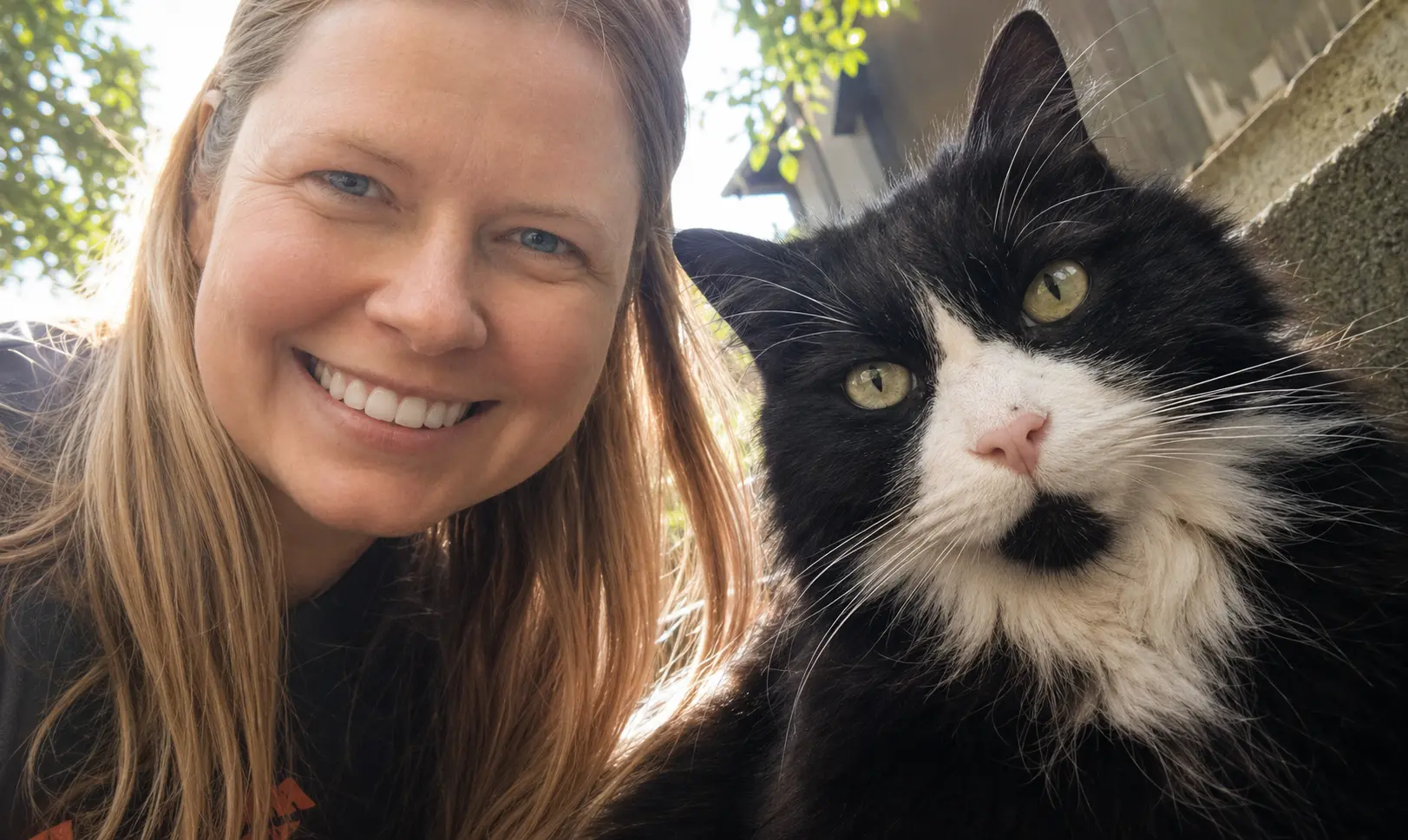 Raisa and Shazam posing close together outside
